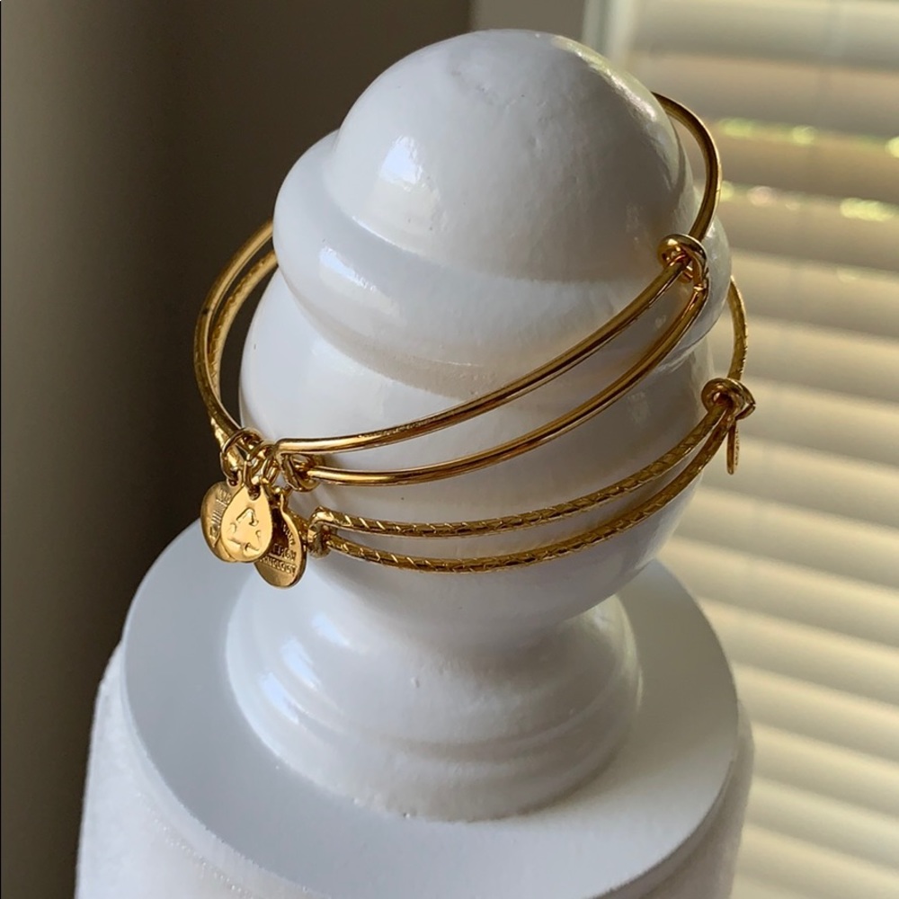 Gold Alex & Ani stackable bracelets